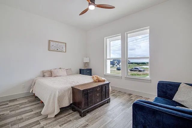 a bedroom with a bed and window