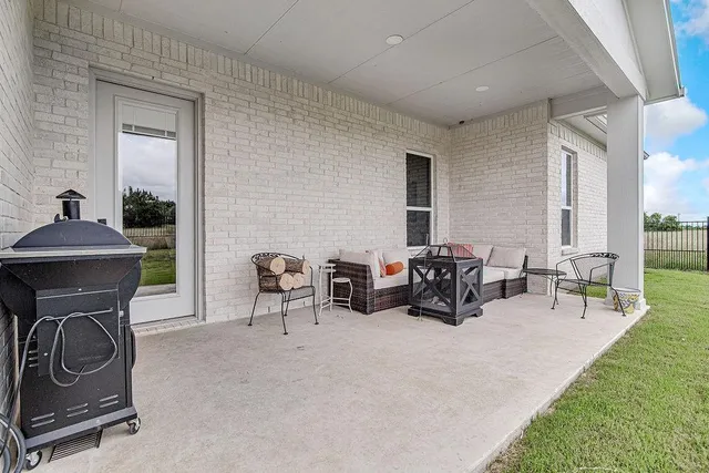 a view of a livingroom with furniture and a fireplace