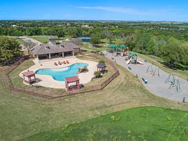 an aerial view of a house with outdoor space