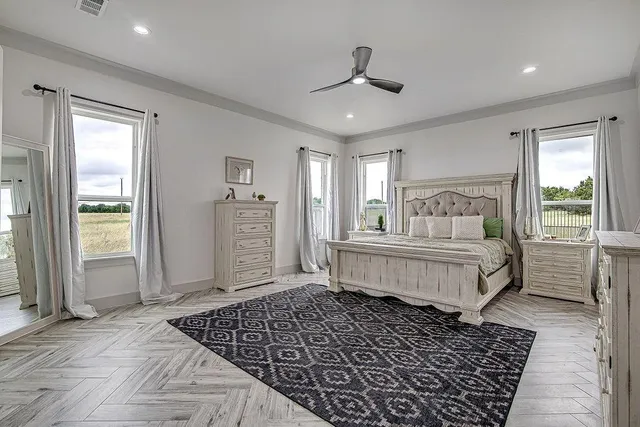 a bedroom with a bed and a window