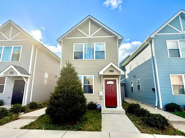 a front view of a house with yard