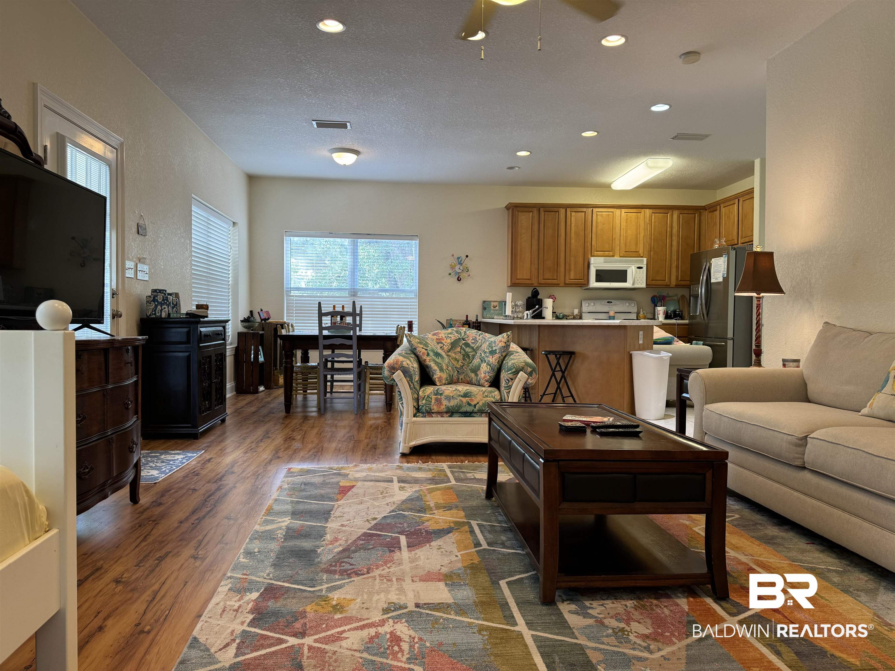 7544 Wenzel Road, Unit B6 Foley, AL 36535 - Photo 7 of 15 Living room featuring dark wood-type flooring and ceiling fan