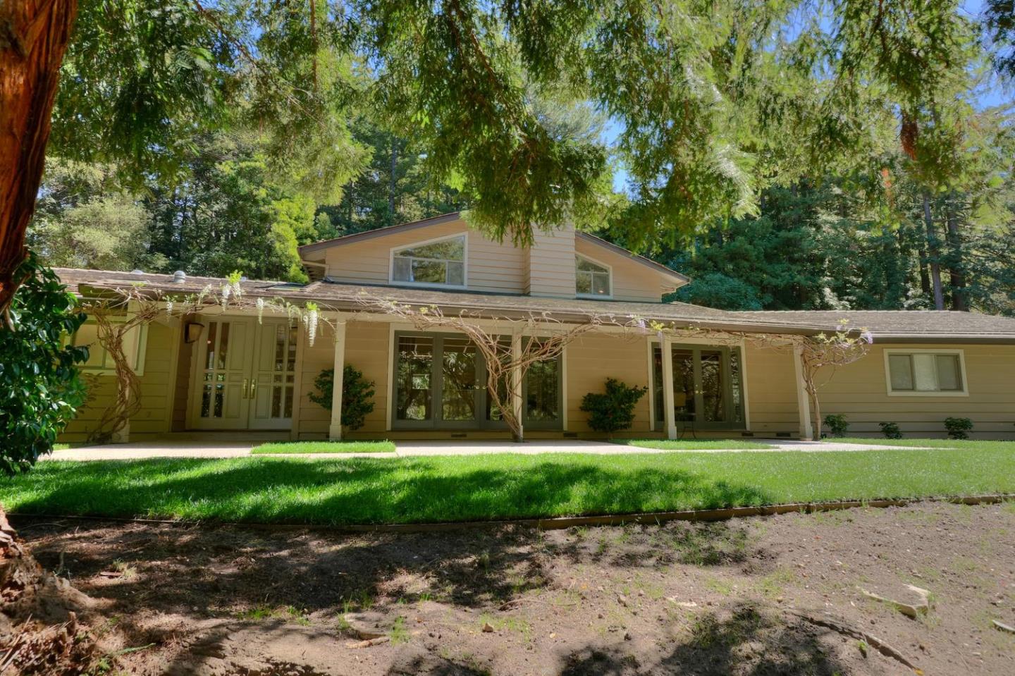 a front view of a house with a yard