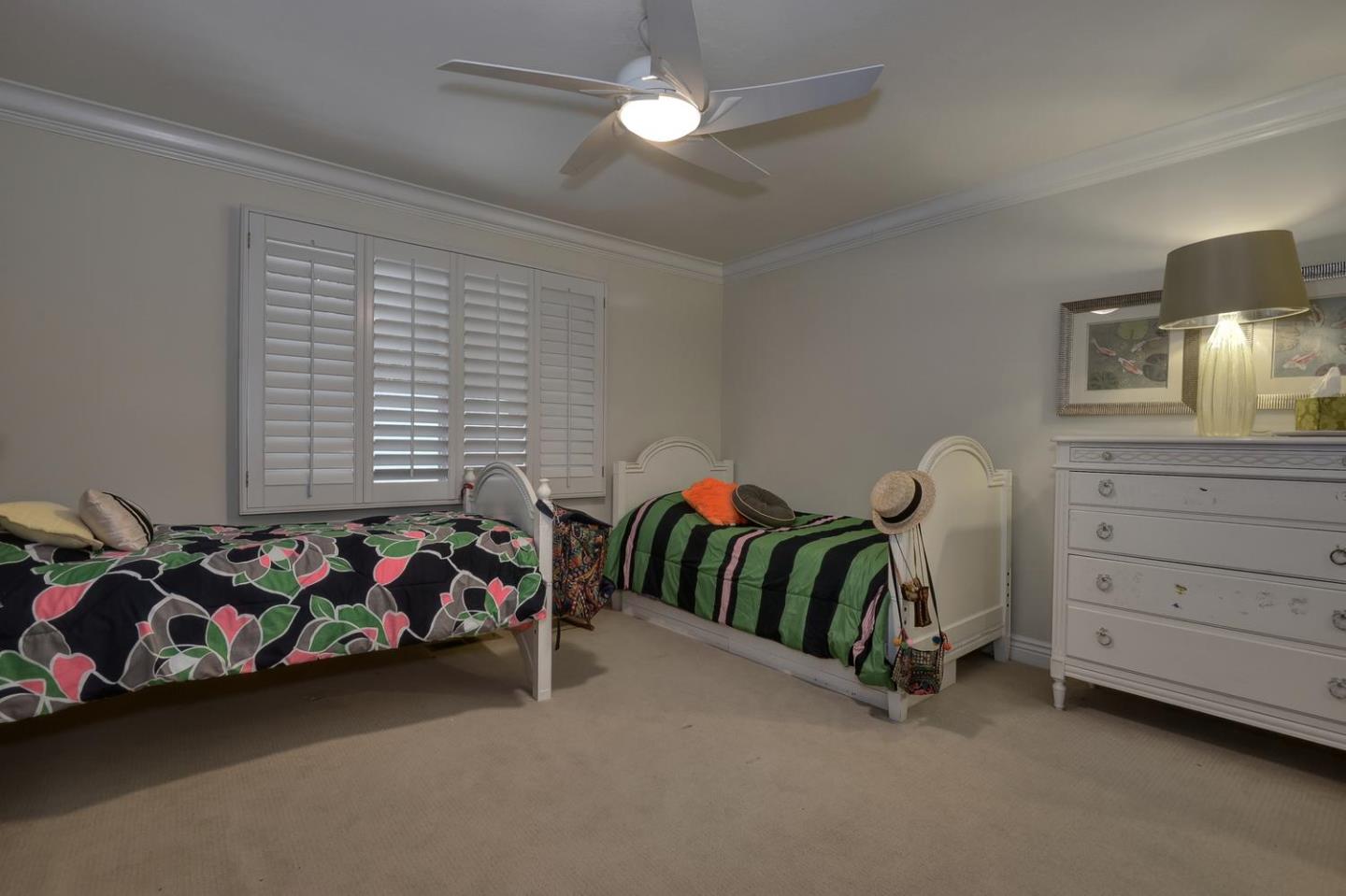 815 Patrol Road Woodside, CA 94062 - Photo 12 of 16 a bedroom with a bed and a chandelier