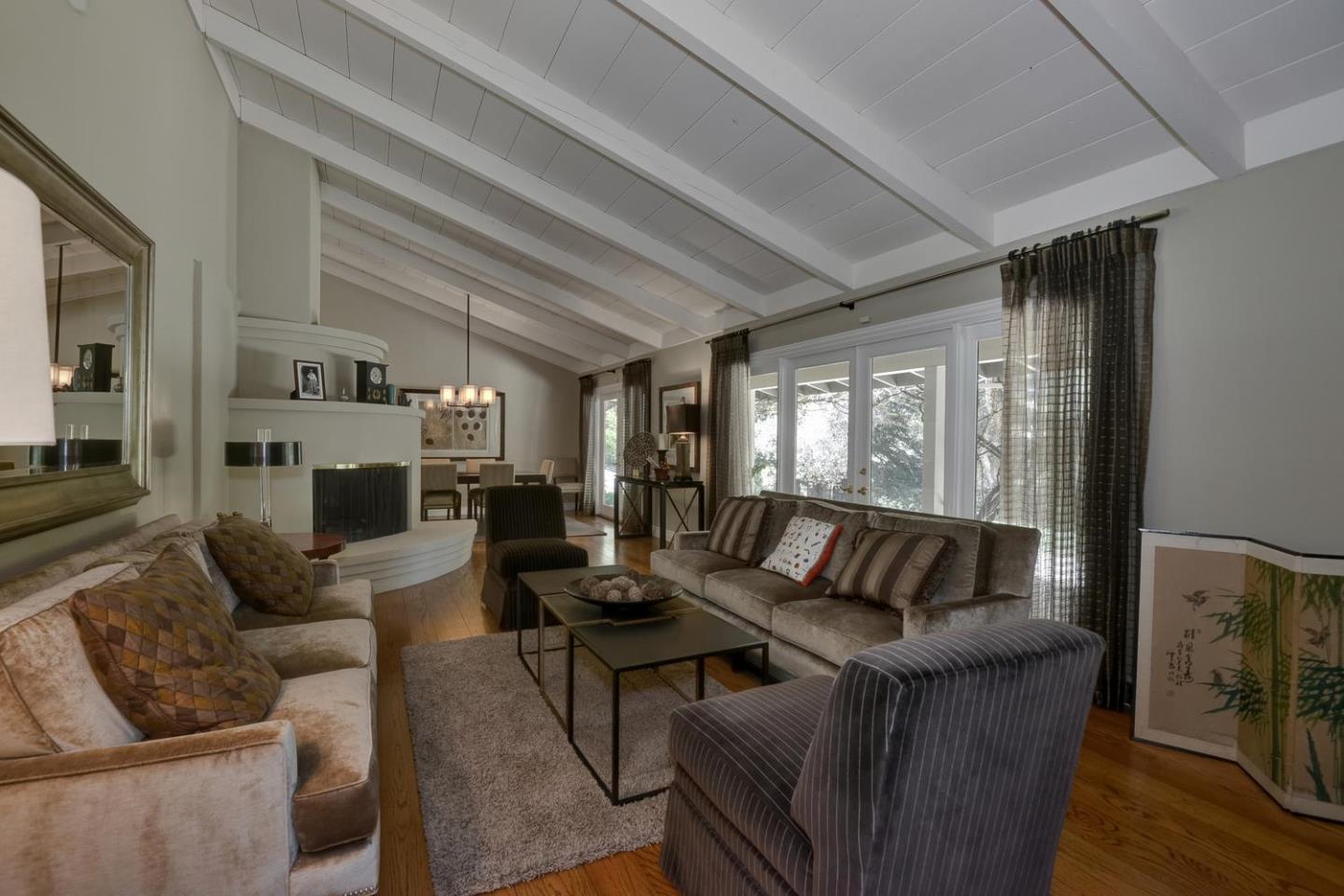 815 Patrol Road Woodside, CA 94062 - Photo 3 of 16 a living room with furniture and a large window