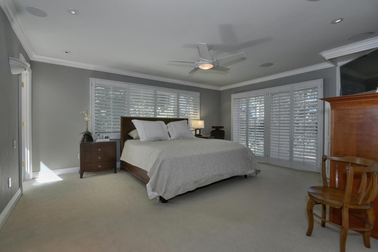 815 Patrol Road Woodside, CA 94062 - Photo 8 of 16 a bedroom with a bed chair and fireplace