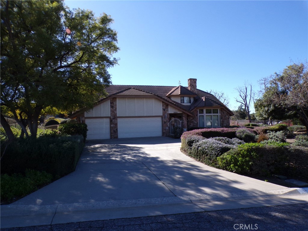 6985 Withers Road Riverside, CA 92506 - Photo 1 of 11 a front view of a house with a yard