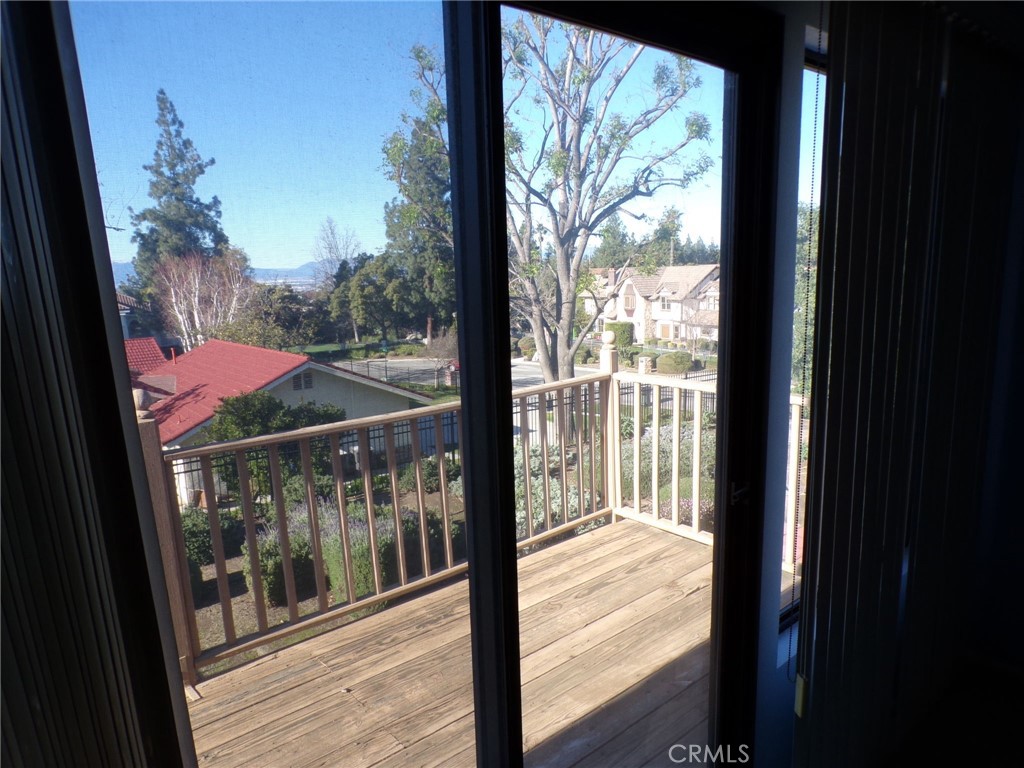 6985 Withers Road Riverside, CA 92506 - Photo 11 of 11 a view of a balcony with a large window and wooden floor