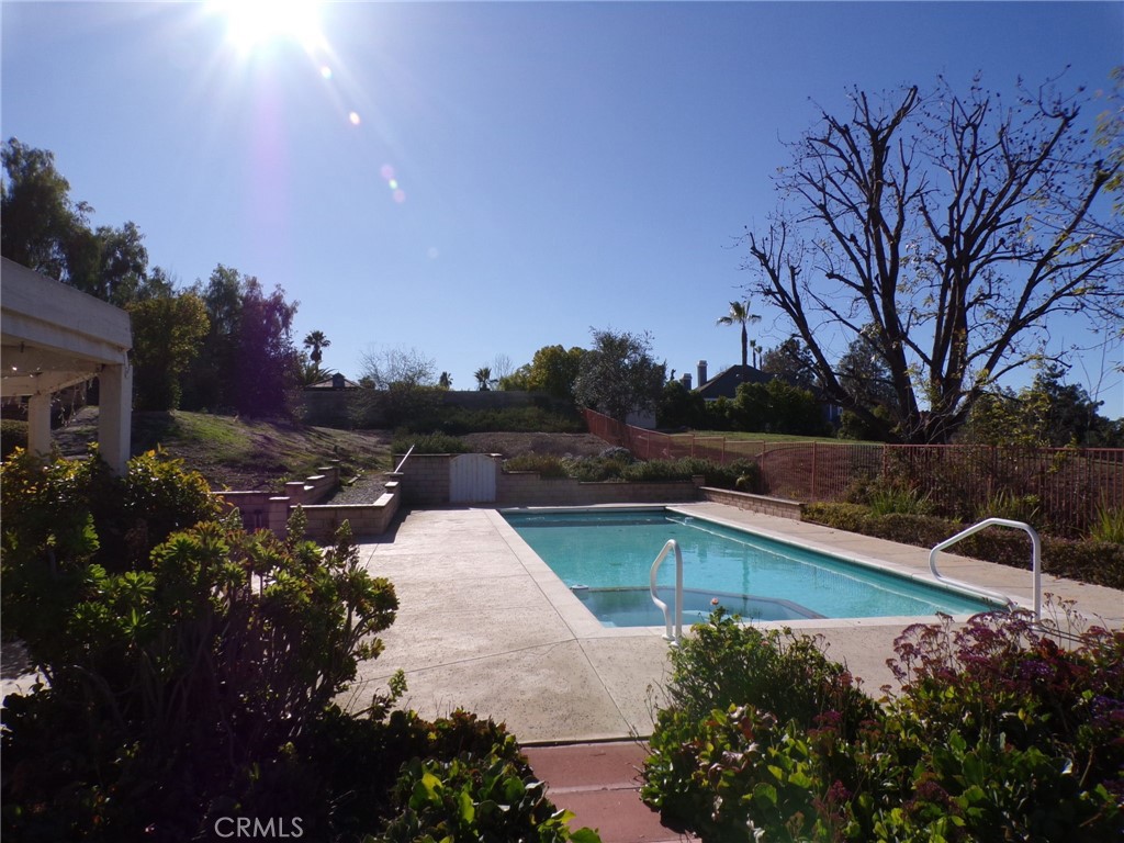 6985 Withers Road Riverside, CA 92506 - Photo 7 of 11 a view of a swimming pool with a yard