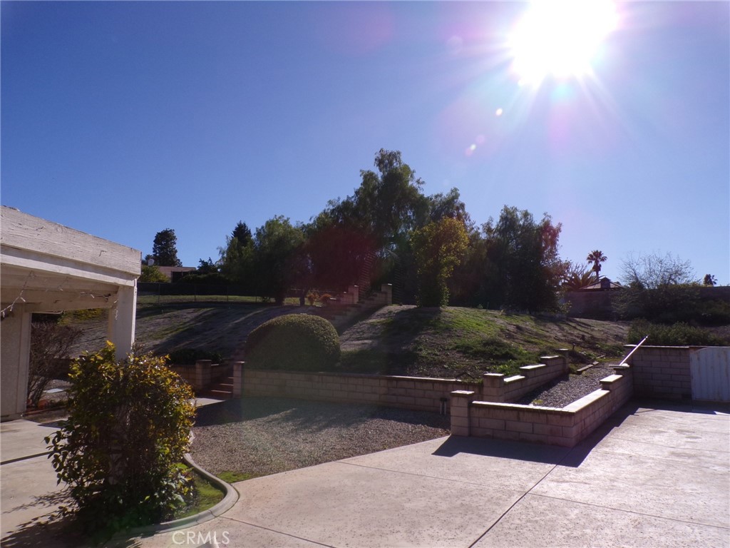 6985 Withers Road Riverside, CA 92506 - Photo 8 of 11 a view of a floor to ceiling window and potted plants
