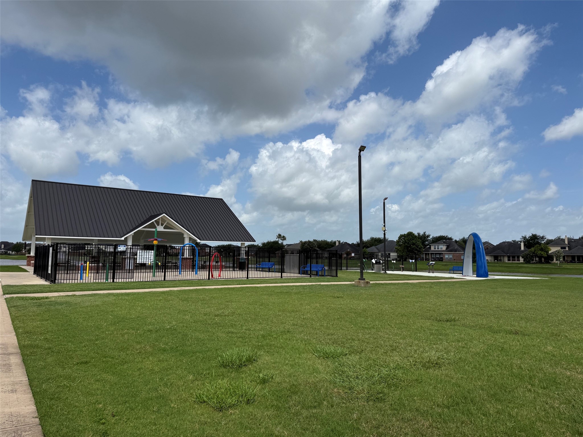 8911 Henrico Lane Rosenberg, TX 77469 - Photo 38 of 45 Spacious grassy play areas, trails around multiple ponds, splash pad and rec center.