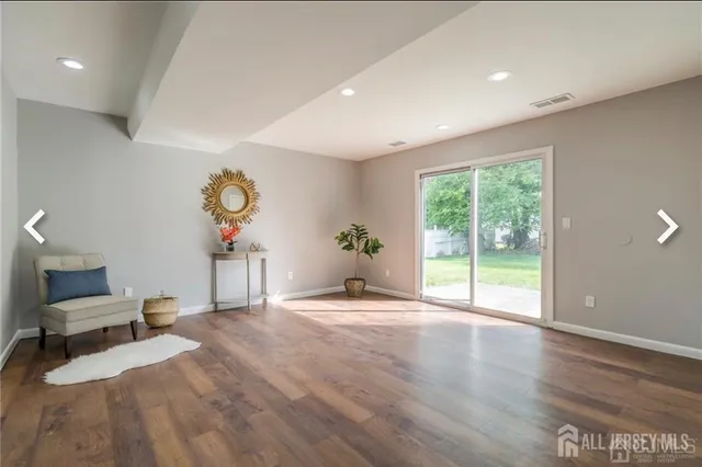 a bedroom with furniture and window