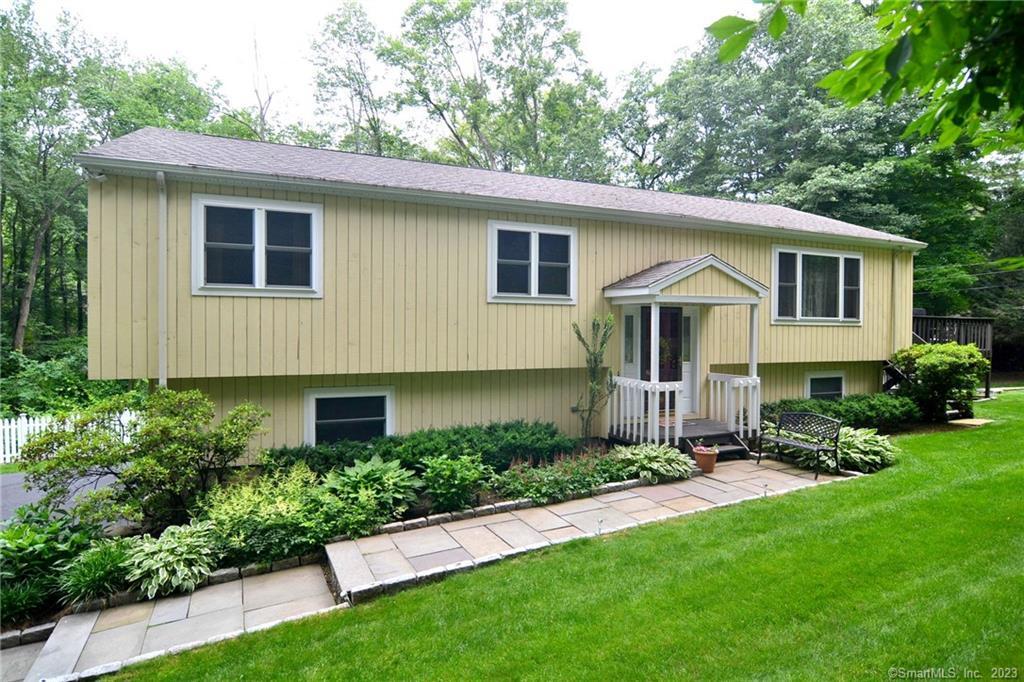 4 Styles Lane Norwalk, CT 06850 - Photo 1 of 1 a front view of a house with a yard and porch