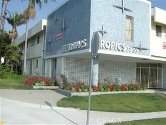 a front view of a building with garden
