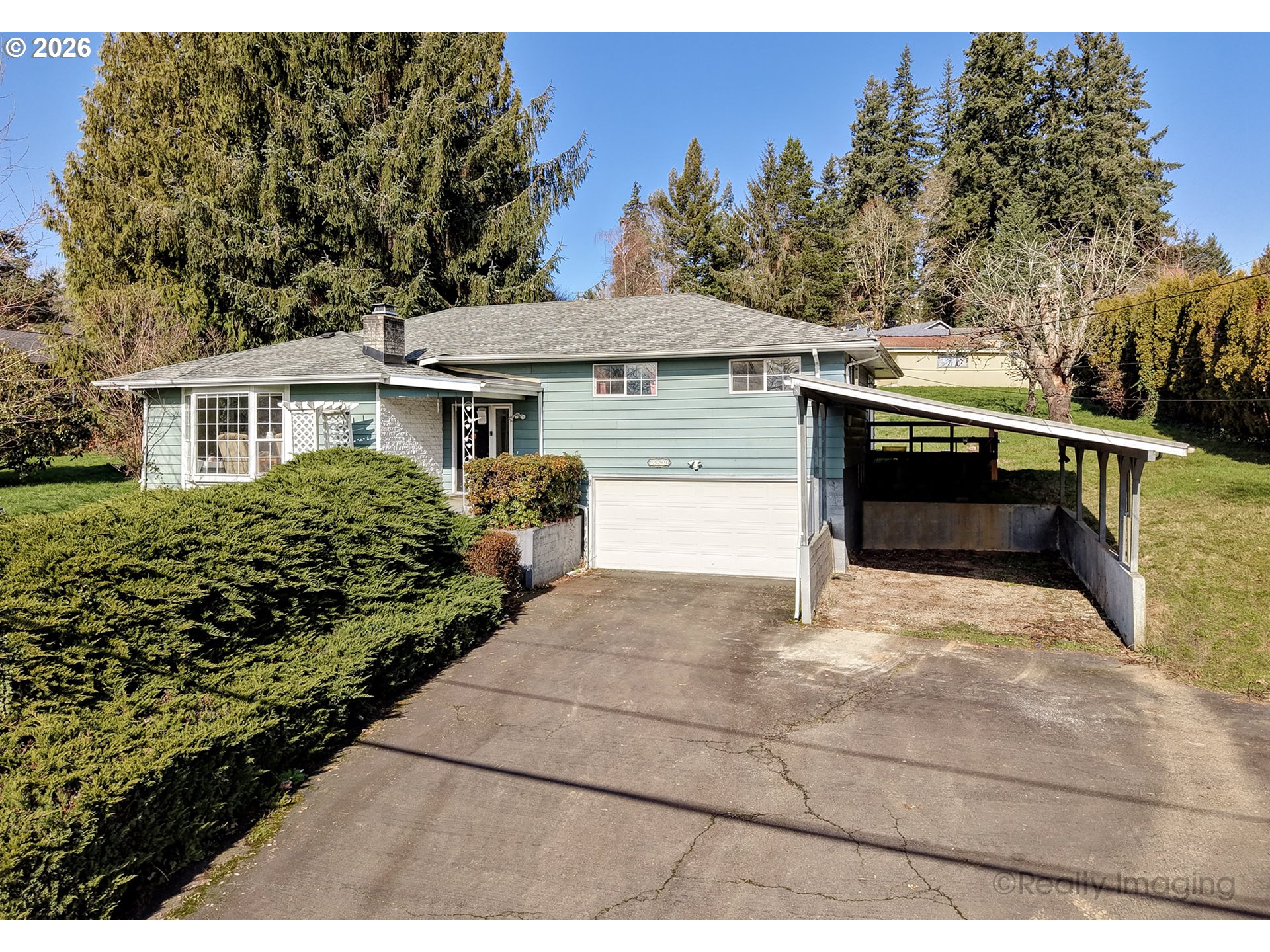 1703 Allen Street Kelso, WA 98626 - Photo 1 of 23 a house with trees in the background