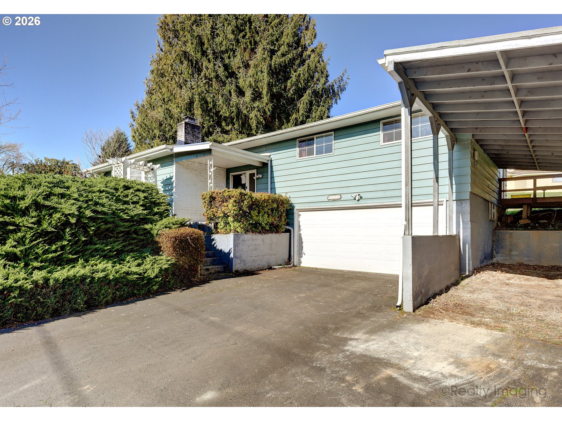 1703 Allen Street Kelso, WA 98626 - Photo 12 of 23 a view of a house with a yard and potted plants