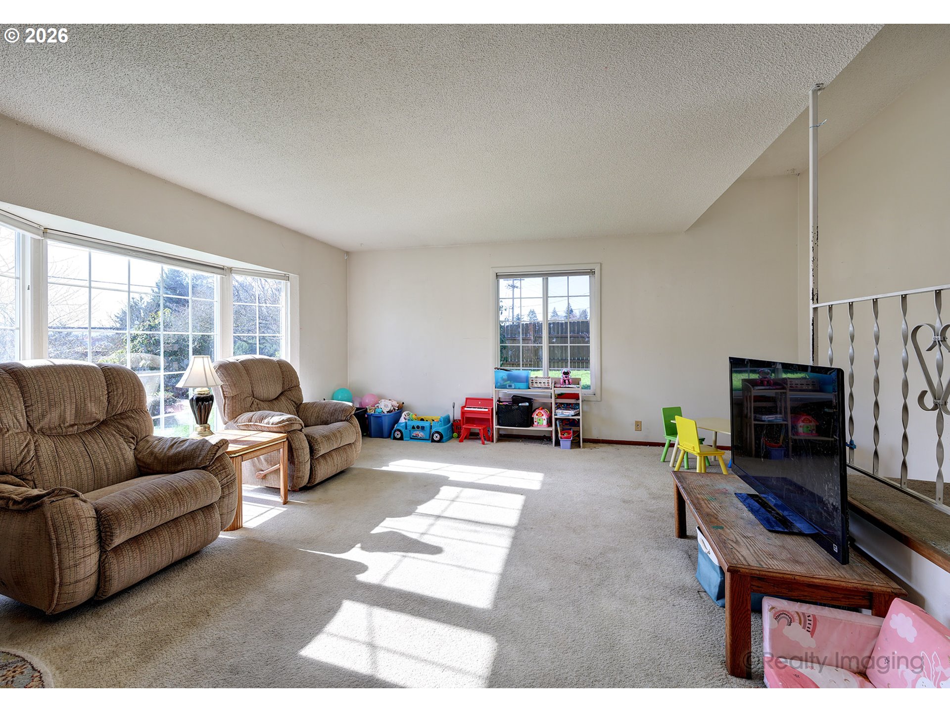1703 Allen Street Kelso, WA 98626 - Photo 20 of 23 a living room with furniture a fireplace and a flat screen tv