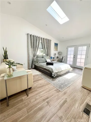 a living room with furniture window and a wooden floor