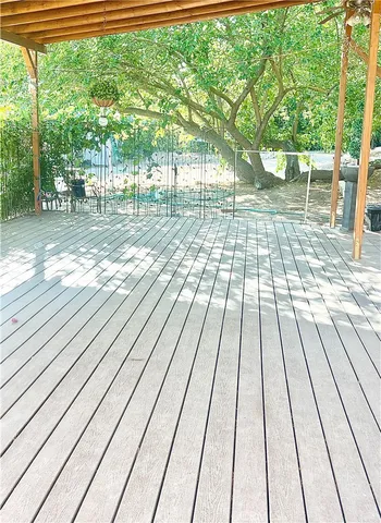 a view of outdoor space with deck and garden