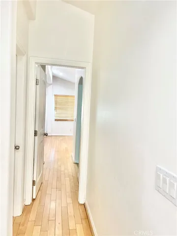 a view of a bathroom from a hallway