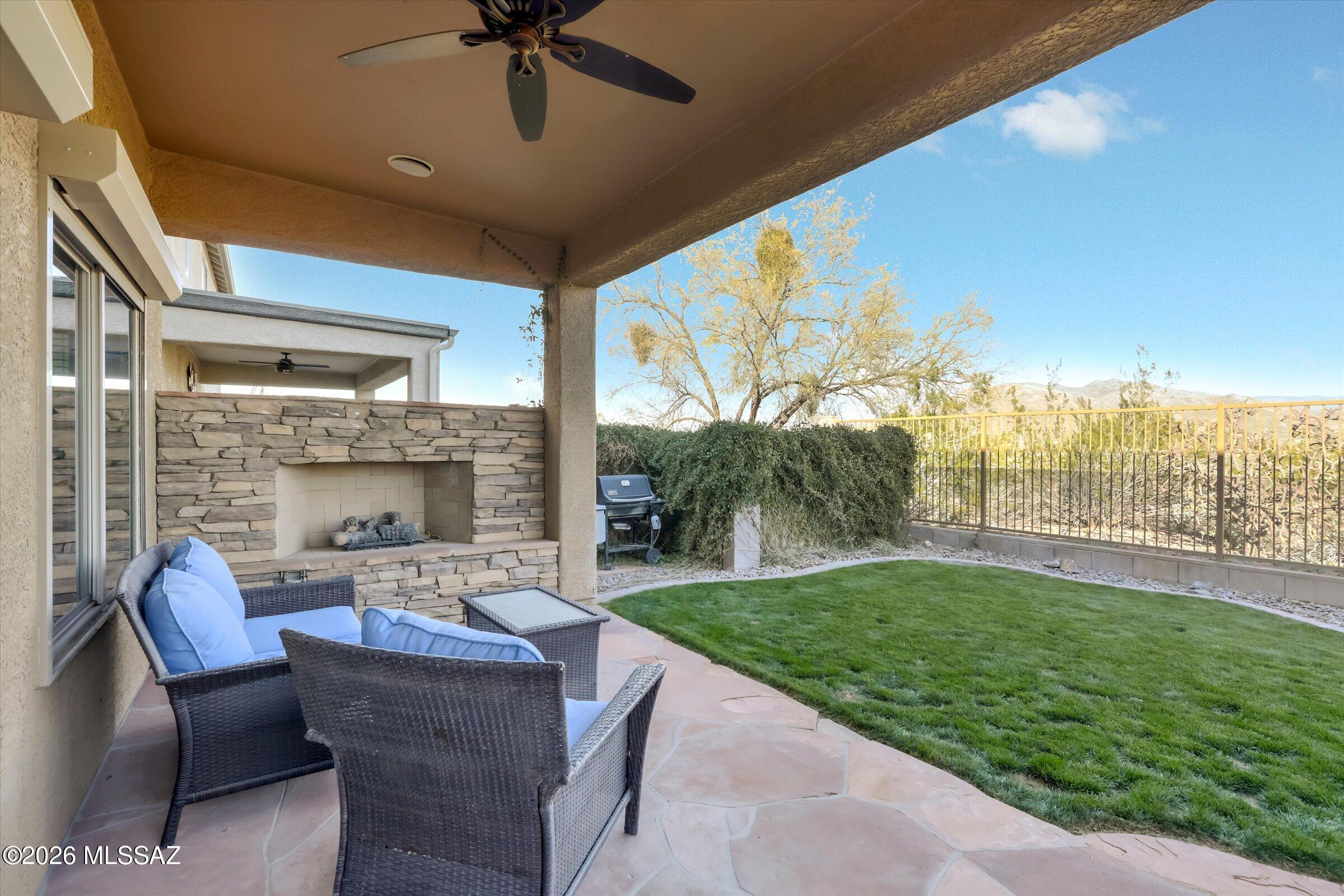 6095 South Jakemp Trail Tucson, AZ 85747 - Photo 5 of 52 a patio with yard table and chairs