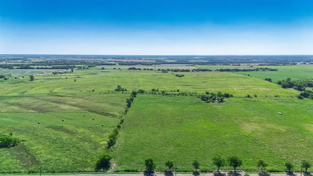 a view of a large building with a yard