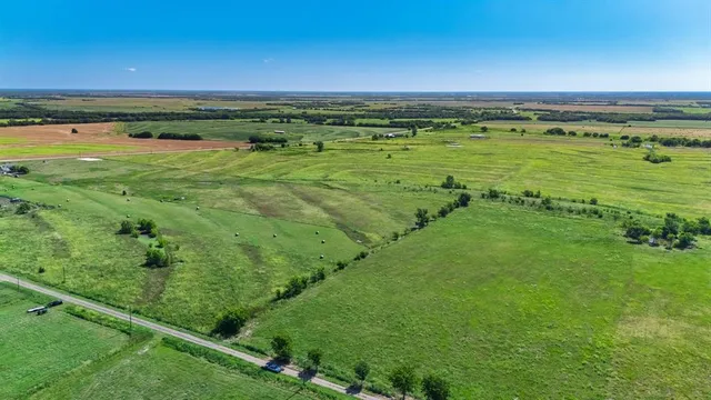 a view of an ocean and a yard