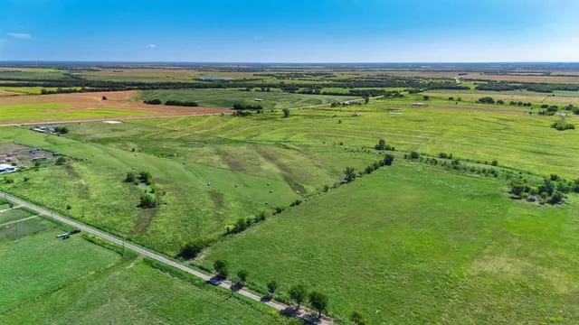 a view of an ocean and a yard