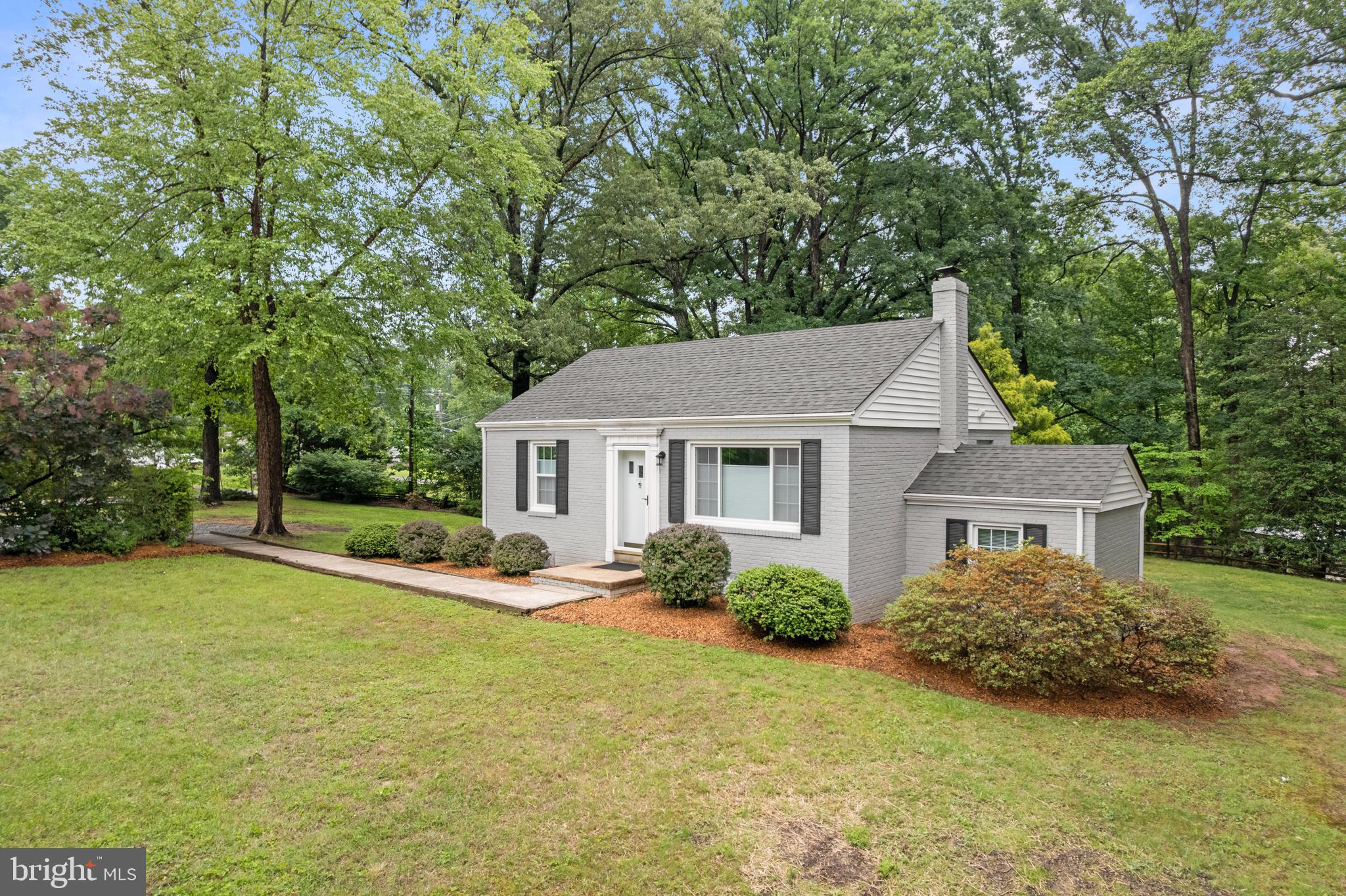 12131 Waples Mill Road Oakton, VA 22124 - Photo 2 of 40 a view of a house with a big yard and large trees