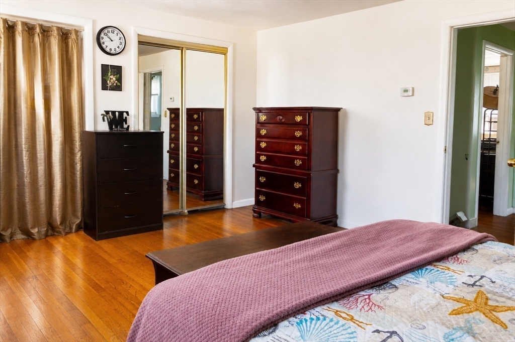 18 Ralston Road Boston, MA 02136 - Photo 9 of 26 a bedroom with a bed and a dresser