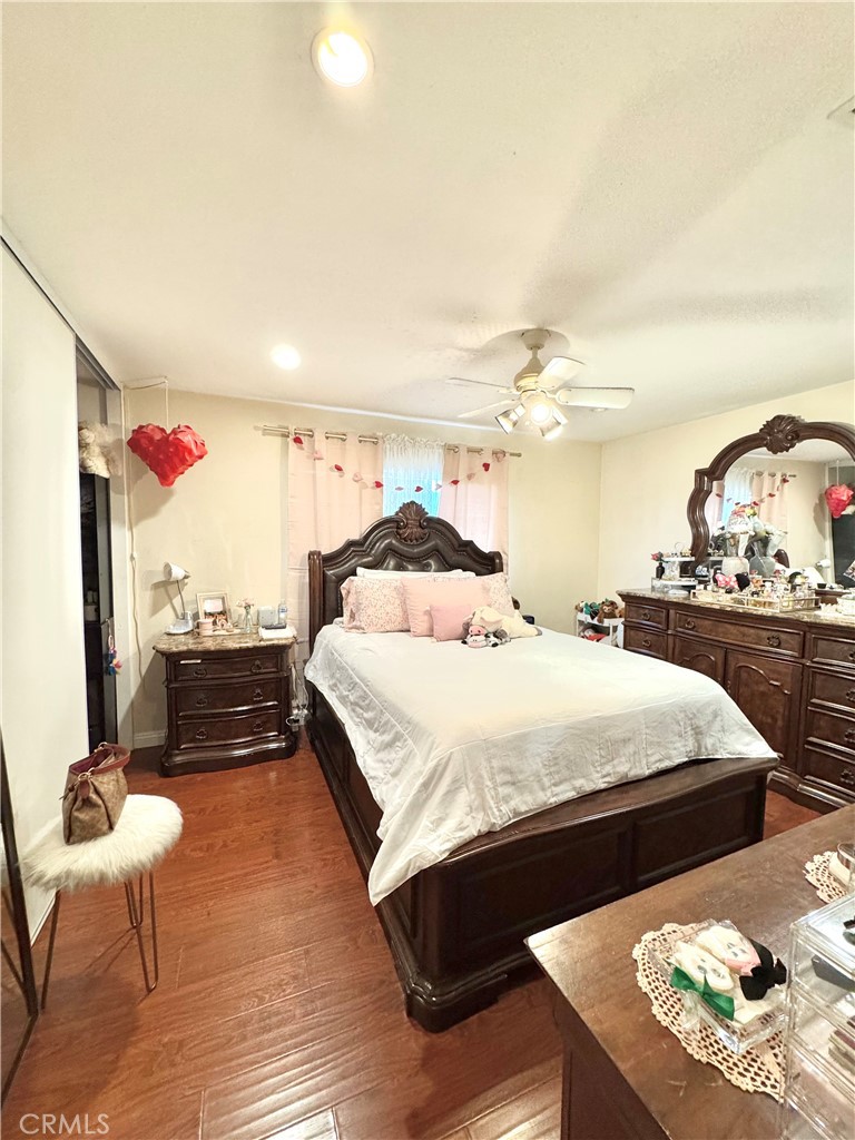 13450 Meyer Road, Unit 33 Whittier, CA 90605 - Photo 6 of 10 a bed room with a bed and a chair