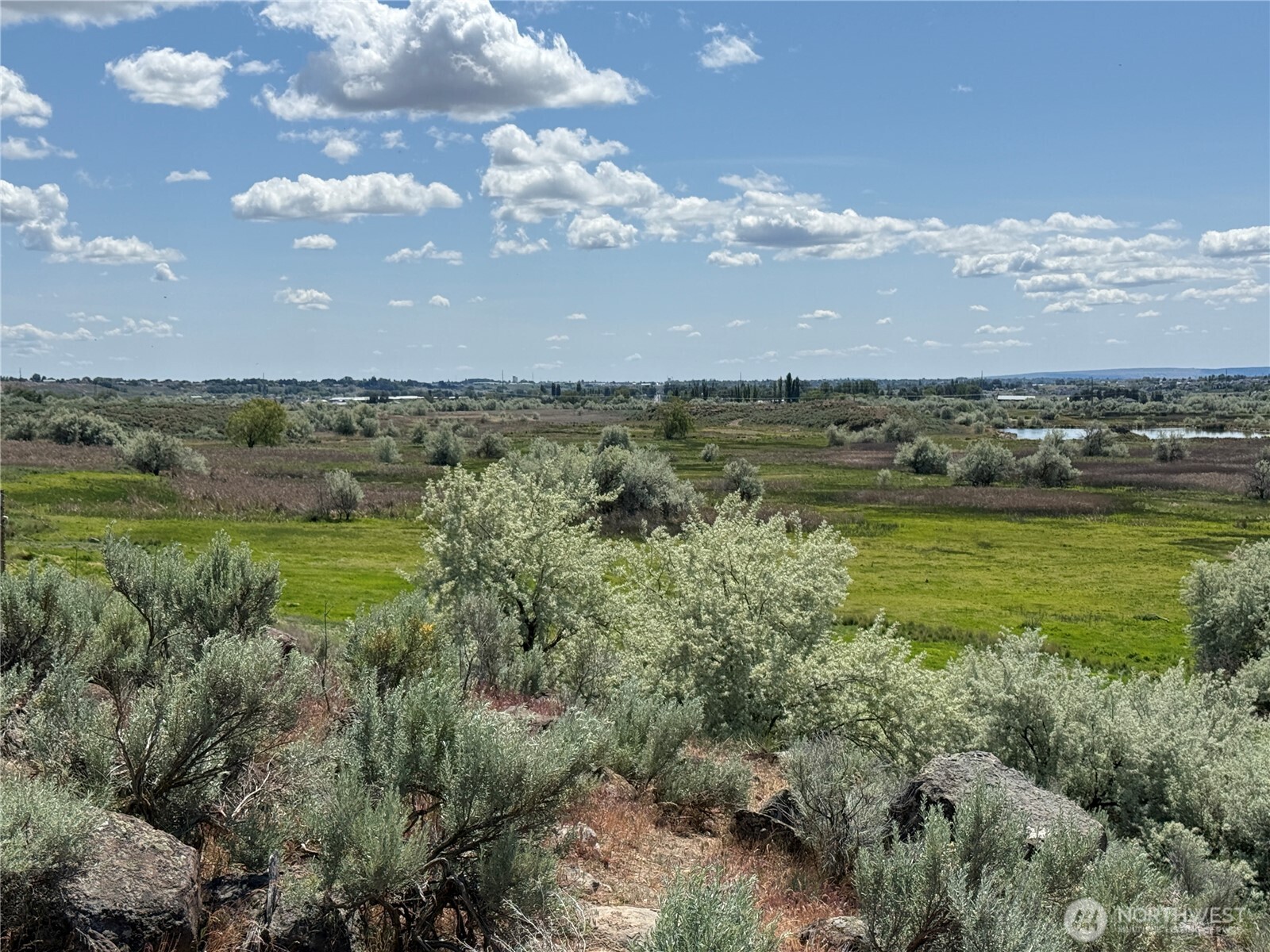 8708 Rd K Northeast Moses Lake, WA 98837 - Photo 26 of 40 a view of a lake with houses in back