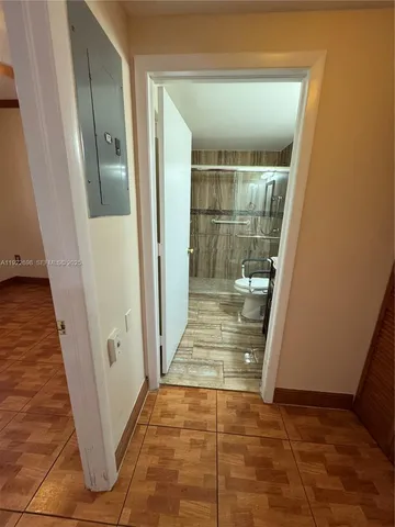 en empty room with window and entrance