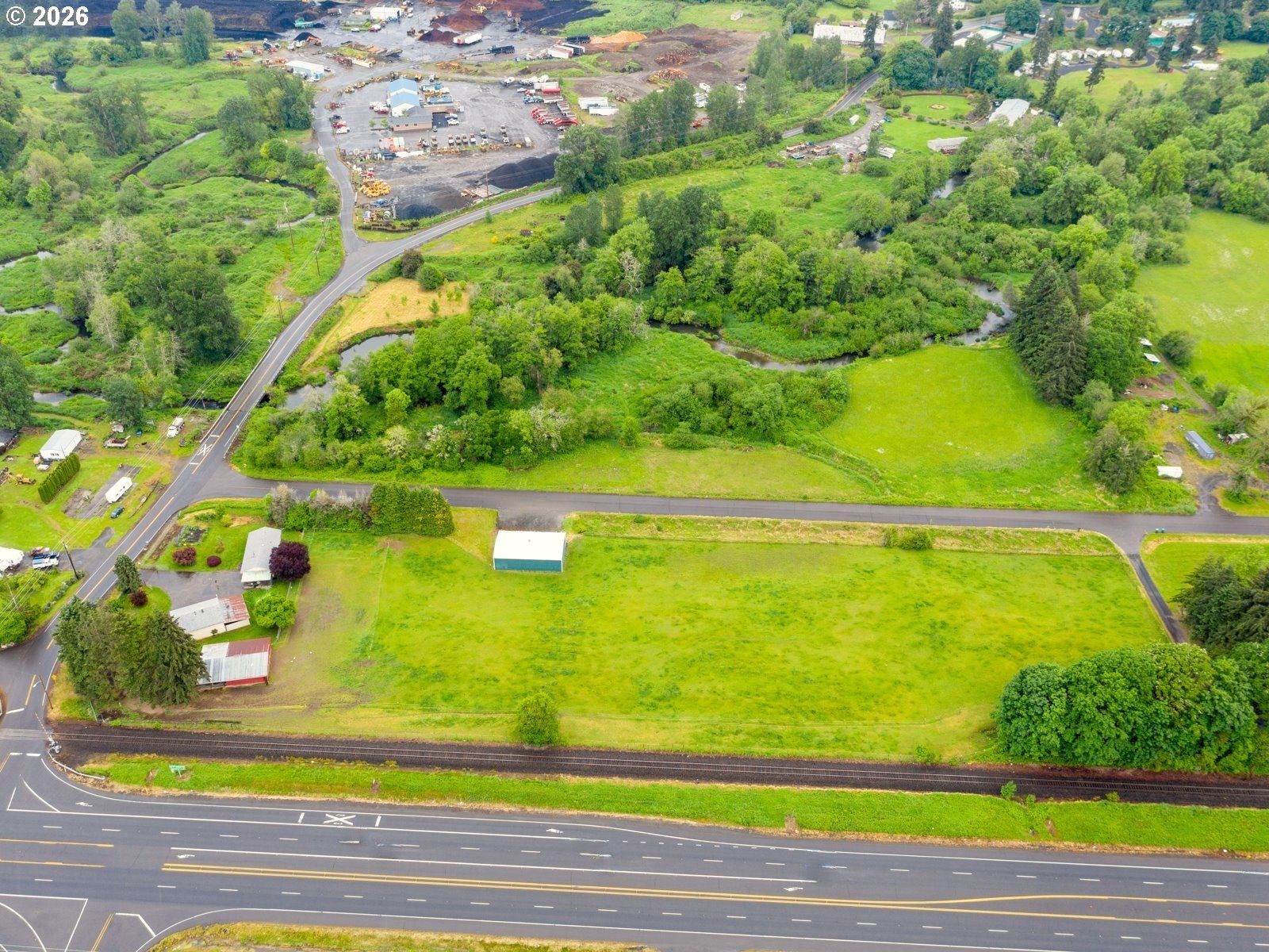 54047 West Lane Road Scappoose, OR 97056 - Photo 44 of 44 a view of a yard with an outdoor space