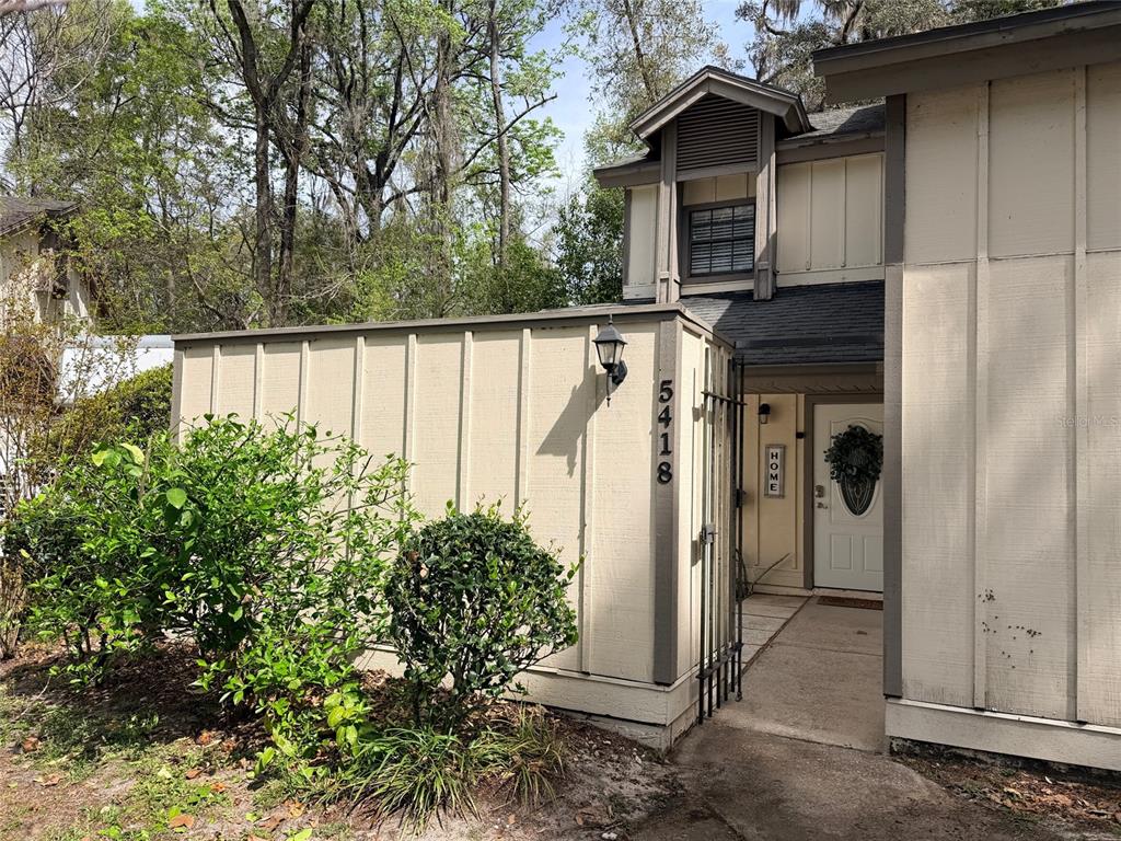 5418 Southwest 4th Place Gainesville, FL 32607 - Photo 1 of 1 a view of a house with a yard and wooden floor