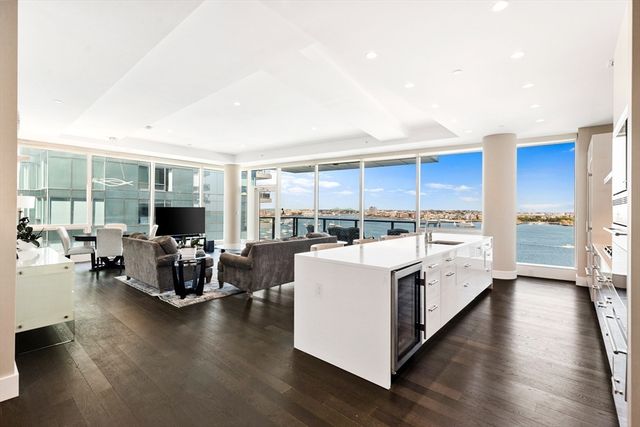 a view of living room with furniture and a flat screen tv
