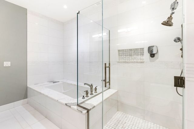 a bedroom with a bed and a mirror