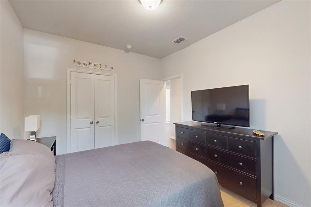 1997 Kieva Place Allen, TX 75013 - Photo 20 of 40 Bedroom with a closet and light colored carpet