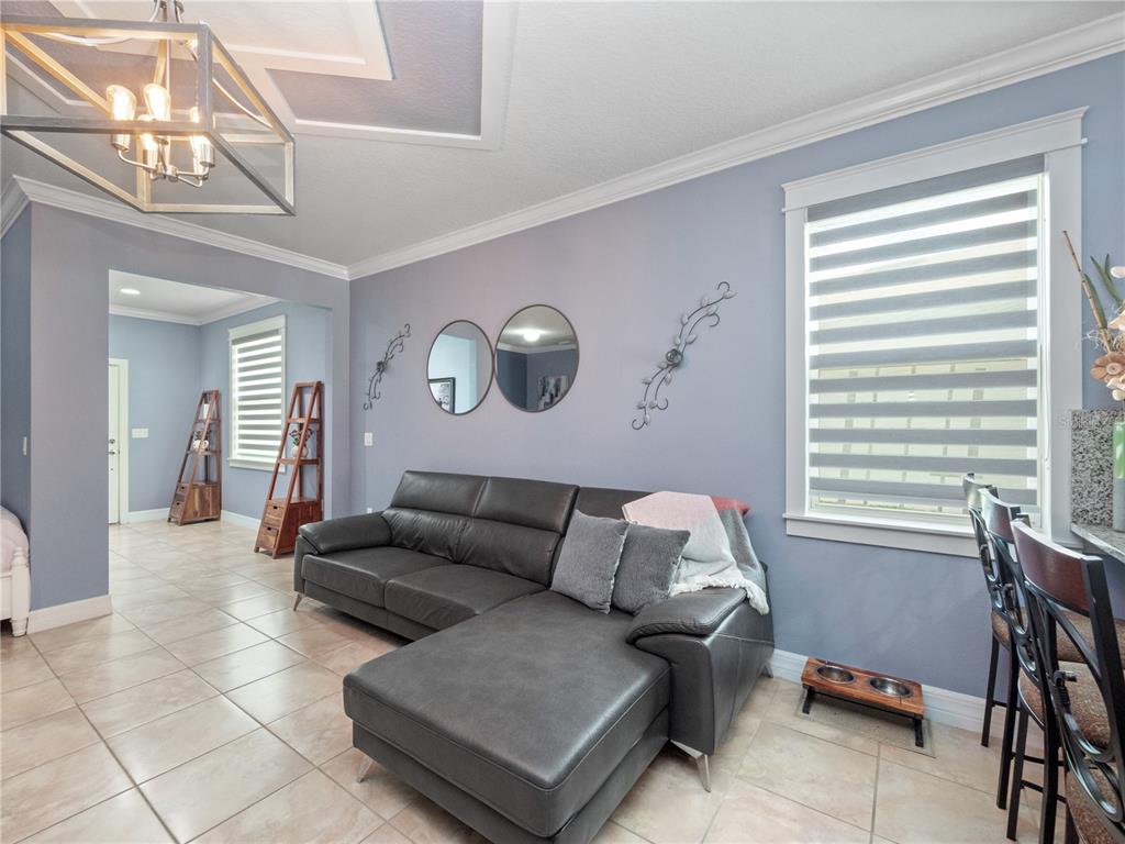 3570 Southern Cross Loop Kissimmee, FL 34744 - Photo 12 of 36 a living room with furniture and a window