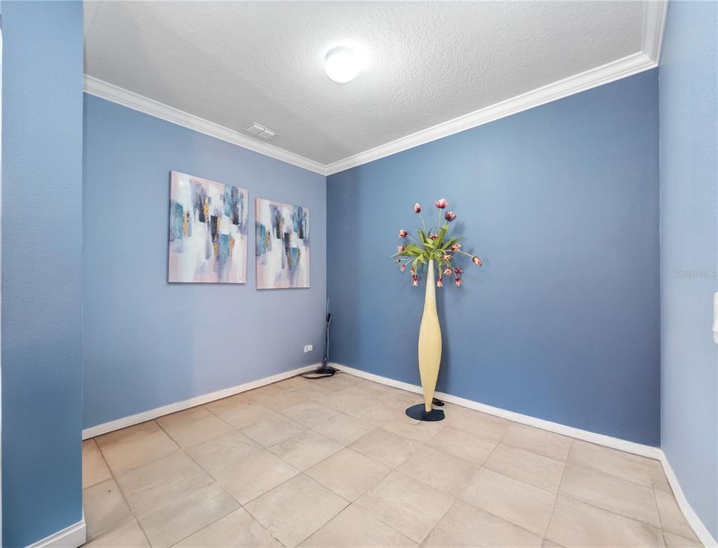 3570 Southern Cross Loop Kissimmee, FL 34744 - Photo 15 of 36 a view of a room with gym equipment