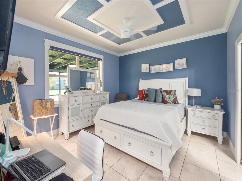 3570 Southern Cross Loop Kissimmee, FL 34744 - Photo 16 of 36 a bedroom with a bed and a desk