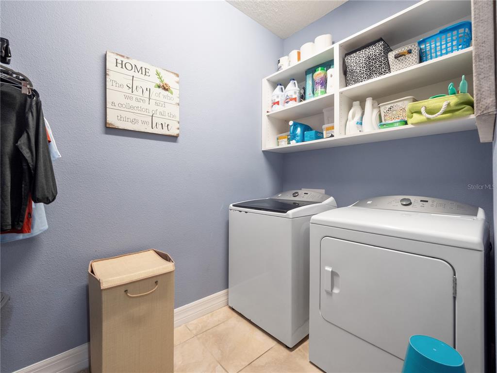 3570 Southern Cross Loop Kissimmee, FL 34744 - Photo 22 of 36 a utility room with dryer and washer