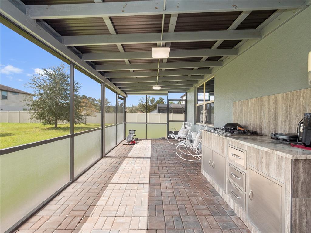 3570 Southern Cross Loop Kissimmee, FL 34744 - Photo 25 of 36 a view of a kitchen with a sink and wooden floor