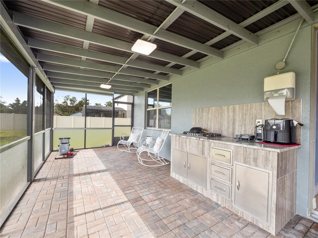 3570 Southern Cross Loop Kissimmee, FL 34744 - Photo 26 of 36 a large white kitchen with sink and breakfast area