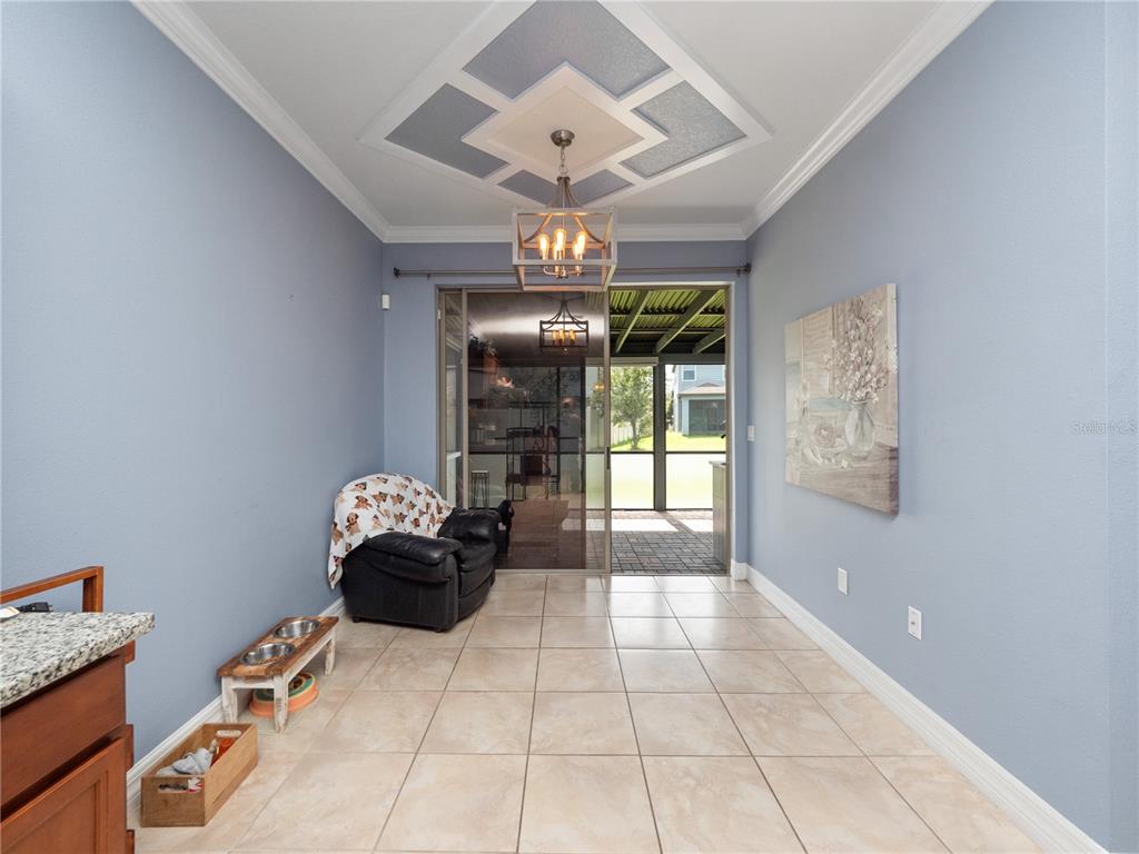 3570 Southern Cross Loop Kissimmee, FL 34744 - Photo 9 of 36 a lobby with furniture and chandelier