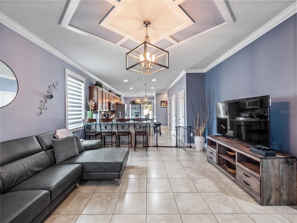 3570 Southern Cross Loop Kissimmee, FL 34744 - Photo 10 of 36 a living room with furniture and a flat screen tv