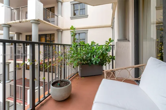 a view of a chair and table in the balcony