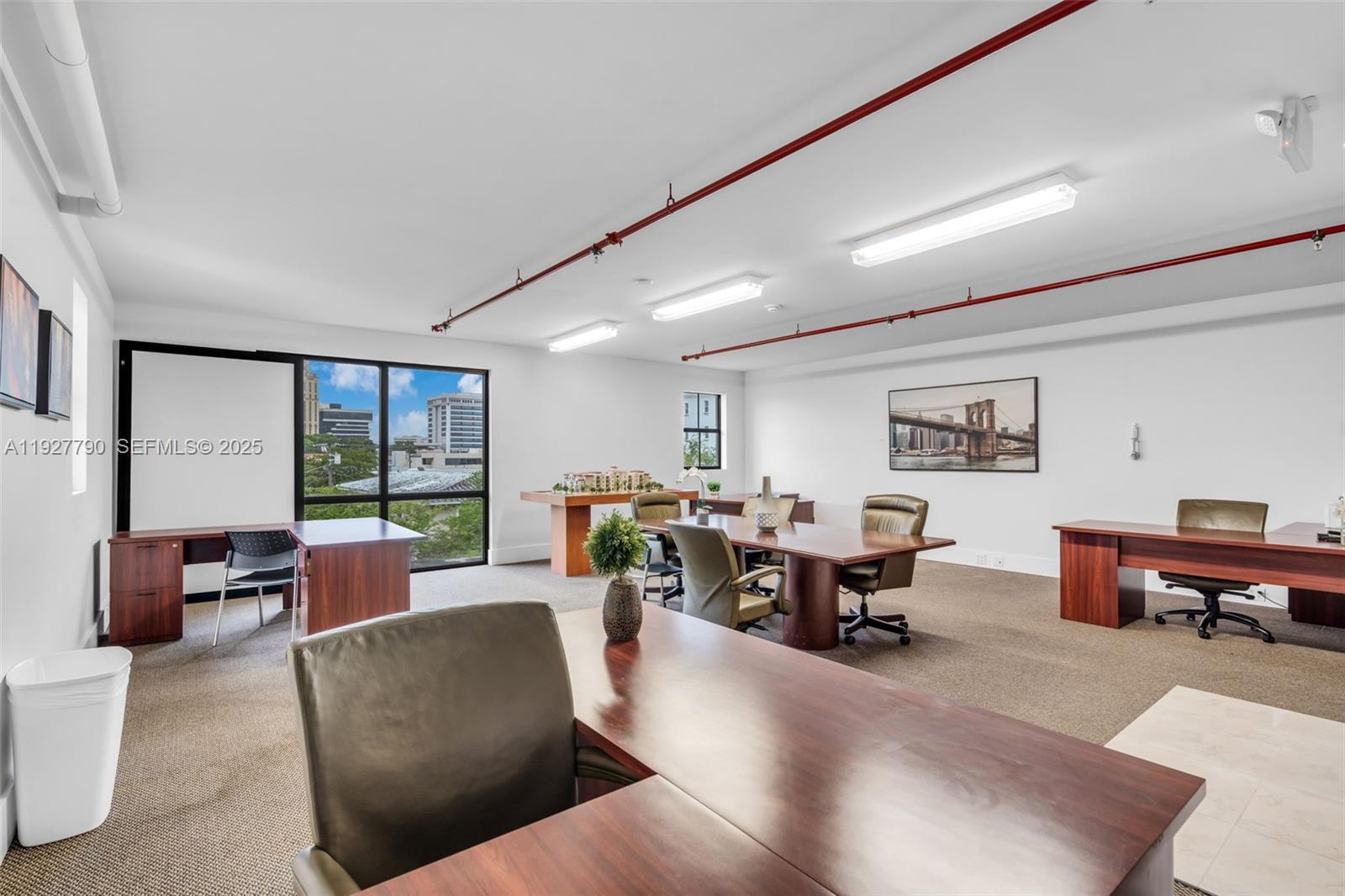 1650 Galiano Street, Unit 311 Coral Gables, FL 33134 - Photo 25 of 32 a living room with furniture kitchen view and a large window