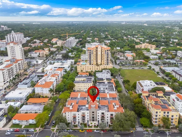 an aerial view of residential building and lake