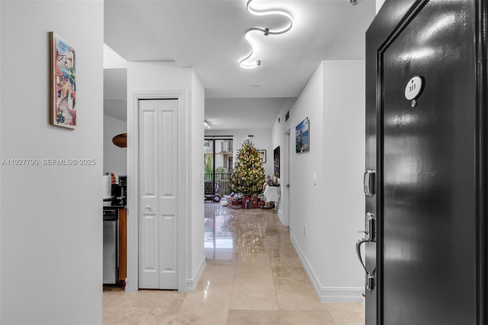 1650 Galiano Street, Unit 311 Coral Gables, FL 33134 - Photo 3 of 32 a view of a hallway with interior of the house